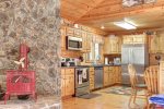 Blac k Bear Lodge with rock wood stove and kitchen.